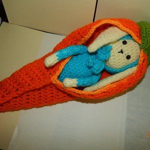 Hand made baby bunny in his carrot bed